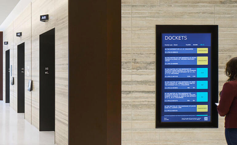 A picture of the kiosks located throughout the Travis County Courthouse building.